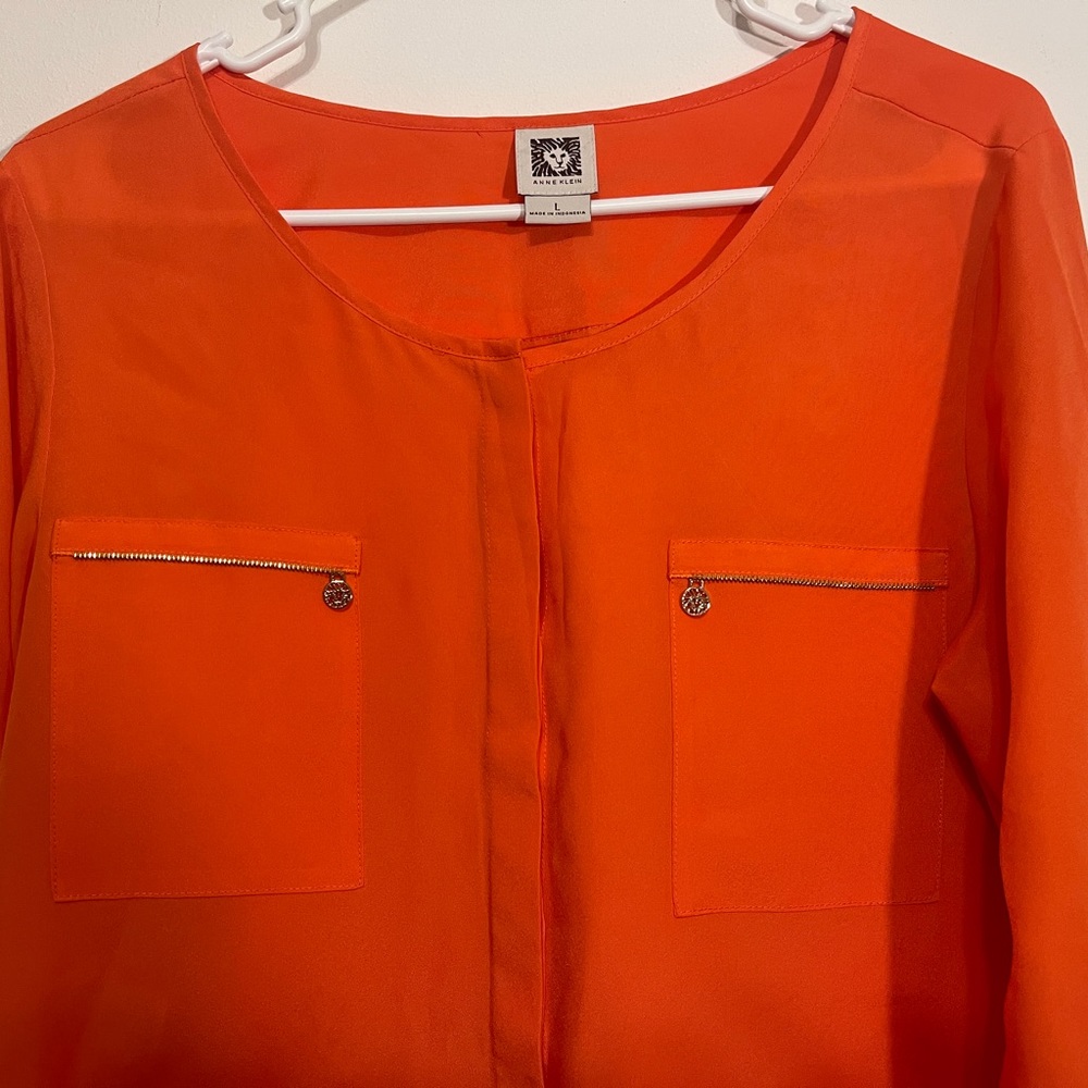 Women cool orange Anne Klein top.